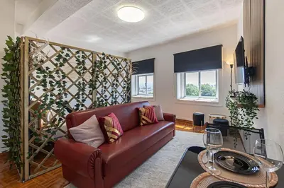 a living room with a couch and a table at Dream Bonfim in Porto