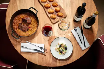 a table with a plate of food and a plate of food at Tivoli Kopke Porto Gaia Hotel in Vila Nova de Gaia