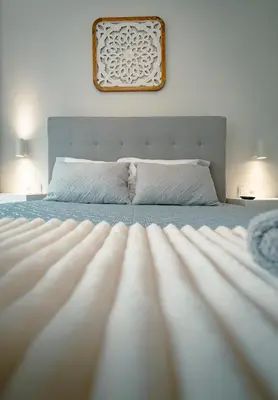 a bedroom with a bed with a picture on the wall at The Cale - Antero de Quental - 11 in Porto