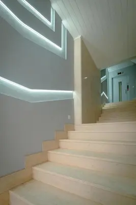 a staircase in a building with wooden floors and lights at The Cale - Antero de Quental - 11 in Porto
