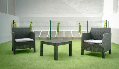 two chairs and a table on a baseball field at The Cale - Antero de Quental - 11 in Porto