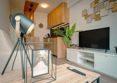 a lamp and a glass picture on a table in a living room at The Cale - Antero de Quental - 11 in Porto