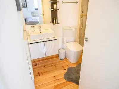 a bathroom with a toilet and a sink at Almada Apartments 468 in Porto