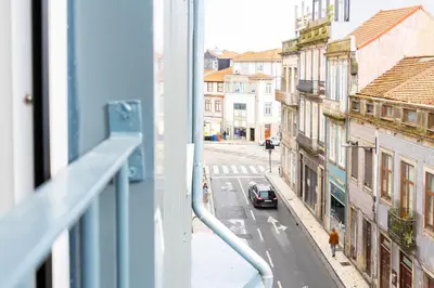 a view of a city street from a window at Grandma aparts in Porto