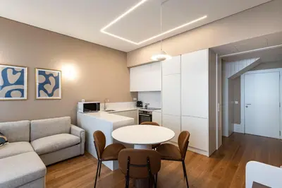 a living room with a couch and a table at ApartmentsPorto - Almada 318 in Porto