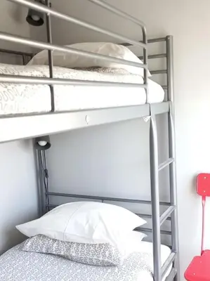 two bunk beds with a pillow on a bed at Lulapartment in Porto