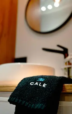 a black towel is sitting on a table at The Cale - Antero de Quental - 12 in Porto