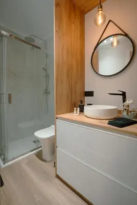 a bathroom with a toilet and a sink and a mirror at The Cale - Antero de Quental - 21 in Porto