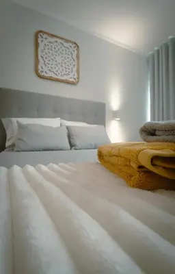 a bedroom with two beds with white sheets at The Cale - Antero de Quental 22 in Porto