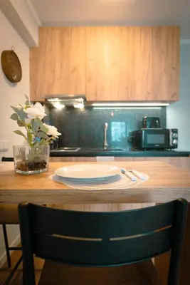 a kitchen counter with a table with a plate on it at The Cale - Antero de Quental 22 in Porto
