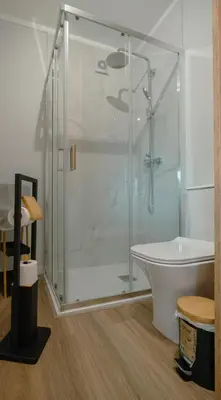 a bathroom with a shower and a tub and a toilet at The Cale - Antero de Quental 32 in Porto