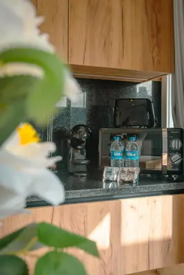 two bottles of water sitting on a kitchen counter at The Cale - Antero de Quental 32 in Porto
