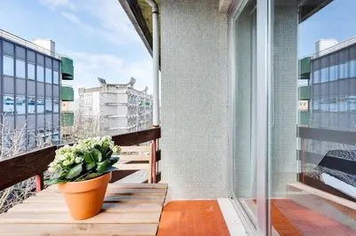 a living room with a couch and a tv at Duque da Terceira Apartment in Porto