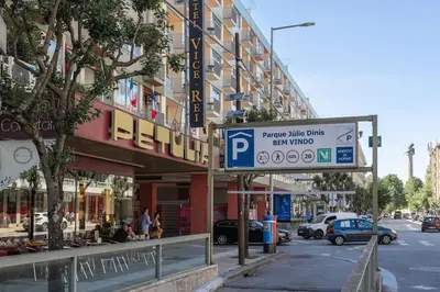 a parking sign in front of a building at Julio Dinis Studio in Porto