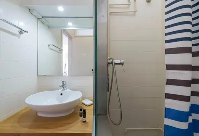 a bathroom with a sink and a shower at BmyGuest - Santa Catarina's Loft in Porto