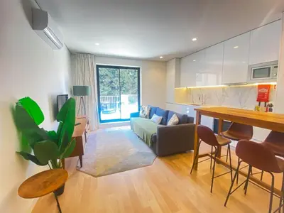 a living room with a couch and a table at Paraíso E in Porto