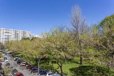 a row of cars parked in a parking lot at Wonderful 2BR Apartment in Boavista by LovelyStay in Porto