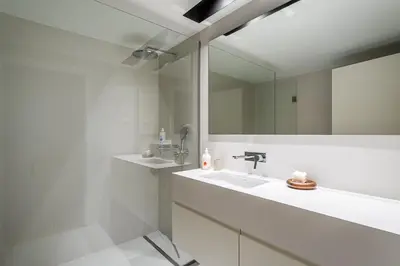 a bathroom with two sinks and a mirror at GuestReady - A peaceful home near downtown in Porto