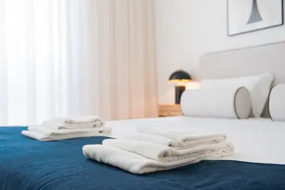 a pile of towels sitting on top of a bed at GuestReady - A peaceful home near downtown in Porto