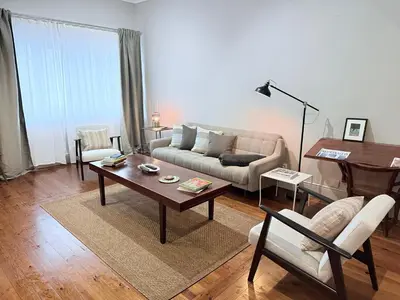 a living room with a couch and a table at Porto Vintage House in Porto