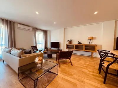 a living room with a couch and a table at Paraíso P in Porto