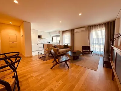 a living room with a couch and a table at Paraíso P in Porto