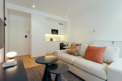 a living room with a couch and a table at Feel Porto Clerigos Charm Flats in Porto