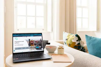a laptop computer sitting on top of a table at Feel Porto Clerigos Charm Flats in Porto