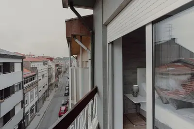 a balcony with a view of a city street at 1BR w/ AC near Palácio de Cristal in Porto