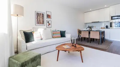 a living room with a couch and a table at 2BR Wonder in the City Center by LovelyStay in Porto