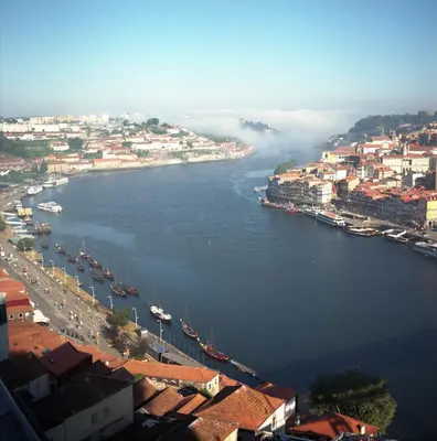a view of a river with boats in a city at Porto Insight Apartments- with balcony in Porto