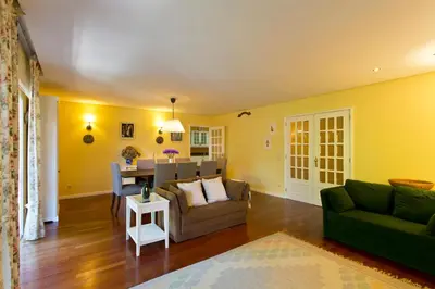 a living room with a couch and a table at VIVA Belos Ares in Porto