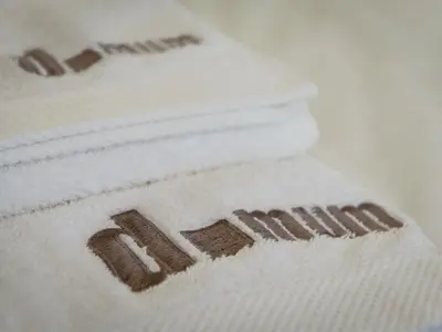 a stack of white towels with the word spa on them at Domum in Porto