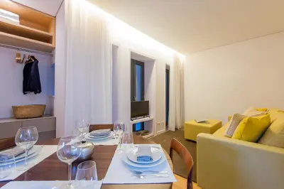 a dining room with a table with wine glasses at Domum in Porto
