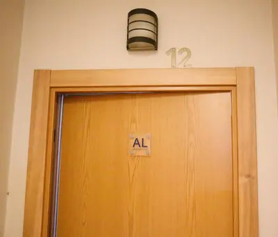 a light above a door with a sign above it at Alma de Cedofeita Apartment in Porto