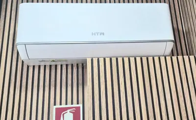 a laptop computer sitting on top of a bed at Alma de Cedofeita Apartment in Porto