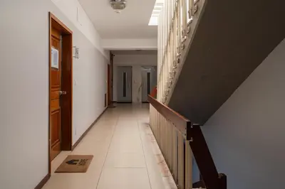 an empty hallway with a staircase in a house at Host Wise - Sunny Bright Flat w Balcony in Porto