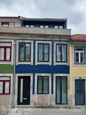 an old house with a blue and white facade at Fontinha House in Porto