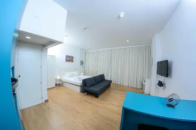 a living room with a bed and a couch at Bonsai Apartment 6 in Porto