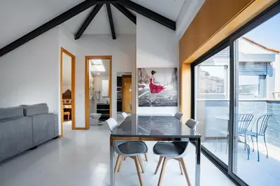 a dining room with a glass table and chairs at Smartr Porto Reis de Gaia & Spa in Vila Nova de Gaia