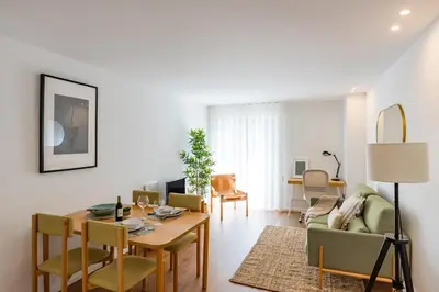 a living room with a table and chairs at Porto Cozy and Design Apartment in Porto Center in Porto