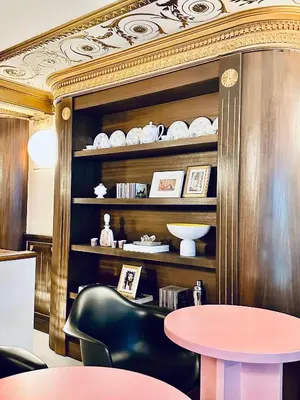 a dining room with a table and a black chair at DEUXMECS Porto in Porto