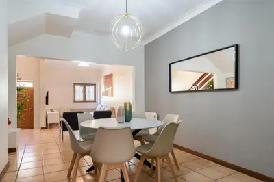 a dining room with a table and chairs at Host Wise - Spacious Duplex House - Jacuzzi & Terrace in Porto
