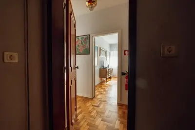 a hallway with a hallway leading to a room at Downtown Aquarelle by Vacationy in Porto