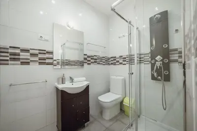 a bathroom with a toilet and a sink and a shower at Downtown Aquarelle by Vacationy in Porto