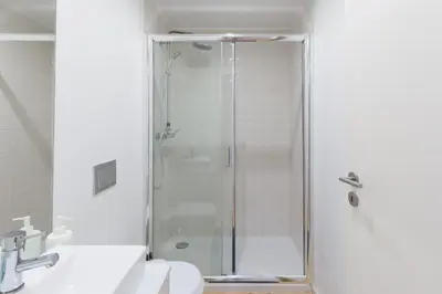 a bathroom with a shower and a sink at Host Wise - Spacious Bright Flat - Terrace in Porto