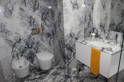 a black and white bathroom with a toilet and a sink at Groove-Wood Loft in Vila Nova de Gaia