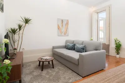 a living room with a couch and a table at Host Wise - Modern Comfy Flat in Porto