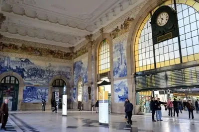 a large building with a clock on the wall at Santa Catarina Oporto City Center in Porto