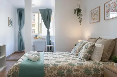 a bedroom with a bed with a teddy bear on it at Host Wise - Enchanting Unique Flat - Ace Location in Porto